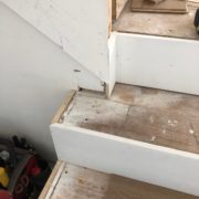 Installing engineered White Oak hardwood flooring stair treads.