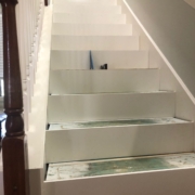 Leveling stair treads with shims.