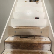 Using template to measure for new stair risers