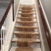 Using template to measure and installing new stair risers