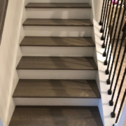 Stained and finished gray stair treads and rails