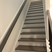 Stained and finished gray stair treads and rails