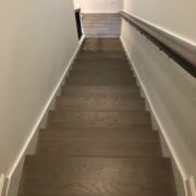 Stained and finished gray stair treads and rails