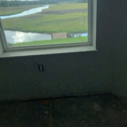 Leveling plywood subfloor and a peek outside