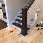 Staining the newel post and hand railing.