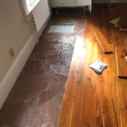 Installing solid Acacia wood flooring.