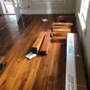 Installing solid Acacia wood flooring.