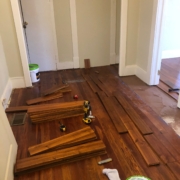 Installing solid Acacia wood flooring.