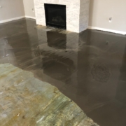 Leveling the concrete slab subfloor.