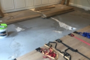 Installing White Oak flooring.