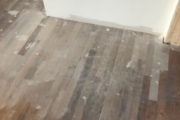 Sanding solid White Oak flooring.