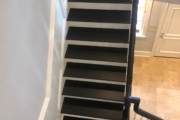 Finished, matte black painted stairway.