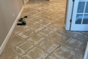 Grinding tile flooring.