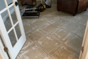 Grinding tile flooring.