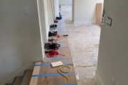 Installing Oak hardwood flooring.