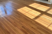 Applying durable Pallmann wood floor finish.