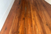 Old Heart Pine wood flooring, prior to refinishing.