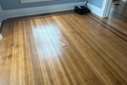 White Oak flooring with Walnut strip trim, before refinishing.