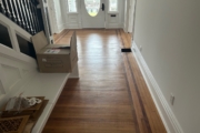 White Oak flooring with Walnut strip trim, before refinishing.