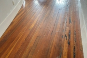 Old Heart Pine wood flooring, prior to refinishing.