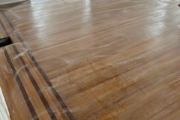 Sanding White Oak flooring with Walnut strip trim.