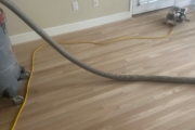 Sanding White Oak flooring.