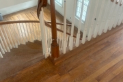 Sanding wood flooring and stair treads.