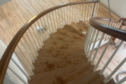 Sanding wood flooring and stair treads.