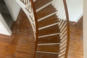 Sanding wood flooring and stair treads.