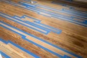 Stained wood flooring weave-in.