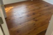 Oak flooring before sanding and recoating.