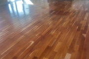 Cupped solid American Cherry wood flooring.