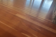 Cupped solid American Cherry wood flooring.