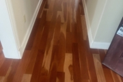 Cupped solid American Cherry wood flooring.