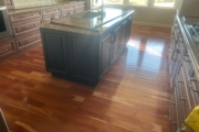 Cupped solid American Cherry wood flooring.