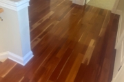 Cupped solid American Cherry wood flooring.