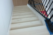 Luxury Vinyl Plank flooring installed on stairs.