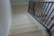 Luxury Vinyl Plank flooring installed on stairs.