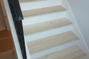 Luxury Vinyl Plank flooring installed on stairs.