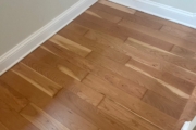 Refinished solid American Cherry wood floors.