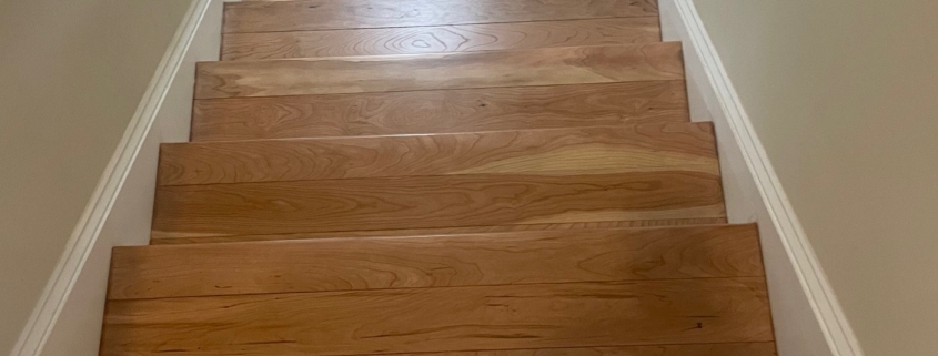 Refinished American Cherry flooring and stairs.