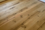 Sanding Oak flooring.