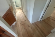 Sanding Oak flooring.