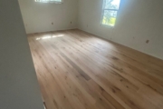 Sanding Oak flooring.