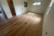 Sanding Oak flooring.