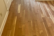 Sanding solid American Cherry wood floors.