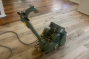 Sanding Oak flooring.