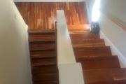 Sanding solid American Cherry wood stairs.