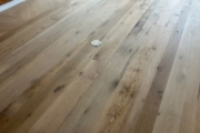 Sanding Oak flooring.