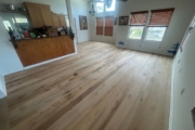 Sanding Oak flooring.